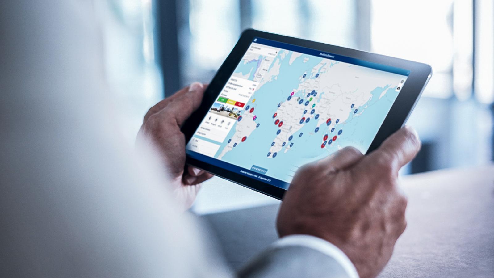 Image of person holding tablet showing Risk Intelligence System